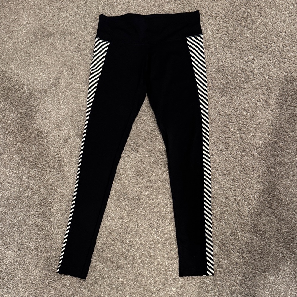 Athleta black leggings with B&W striped side panels XS
